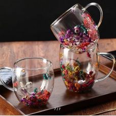 Double wall glass cup with dried flowers