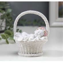 Souvenir angel "Baby in a pink wreath sleeps in a basket"
