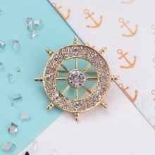 Brooch "Steering wheel", white in gold