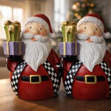 Ceramic Santa Claus figurine with a gift